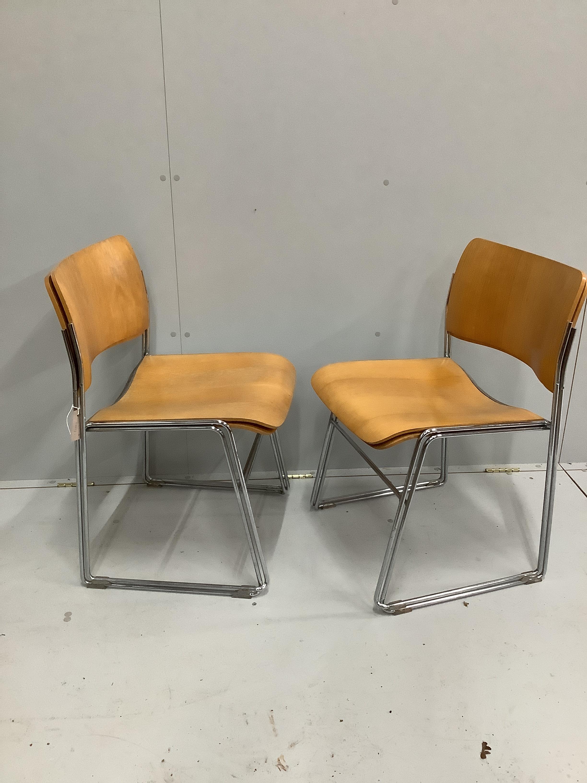Four mid century 'Howe' bent ply and chrome stacking chairs